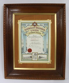 Dark brown wooden frame on a colour certificate for past officers in the Wodonga sub-branch of the Victorian Branch of the Australian Railways Union.