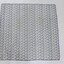 Scarf with the Sarah Coventry logo printed repeatedly in blue on a white background, with a black and white 5 cm scale.
