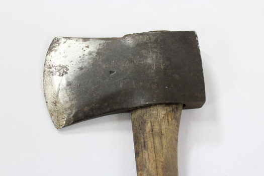 Haeusler Collection Wooden Axe c. early 1900s, detail of steel axe head showing scratches and scuffing marks from use