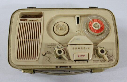 Birds eye view of the reel to reel tape recorder showing rotating knobs 