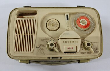 Birds eye view of the reel to reel tape recorder showing rotating knobs 