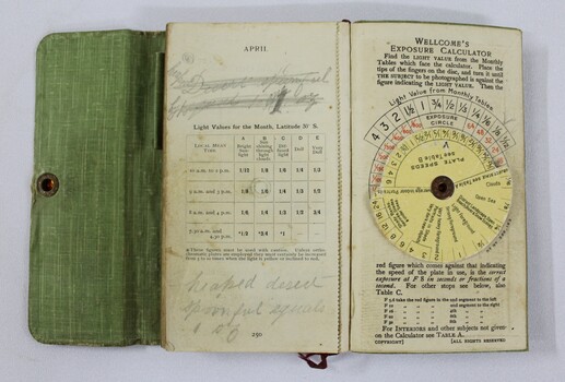 Photographic exposure calculator on back pages of exposure record book