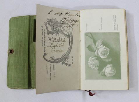 Open exposure record showing owners signatures on front pages, and a photograph of some roses