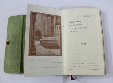 Open photographic exposure record, showing a photograph from inside a church and the print date, 1906