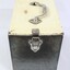 One end of a rectangular grey metal railways lunch box.