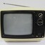 Cream and black plastic Sanyo colour television,