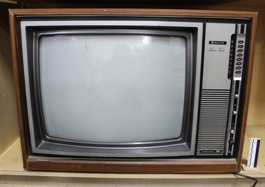 Large Sanyo 'Sensor Touch' colour television with a faux wooden veneer frame and exterior.