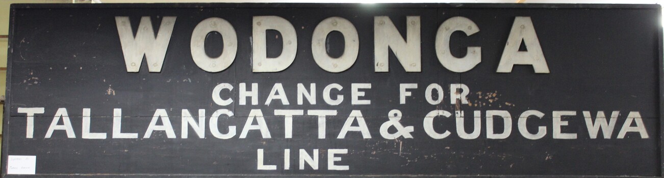 Painted wooden sign from the Wodonga train station.