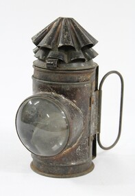 Black painted metal signal lamp with a clear glass lens.