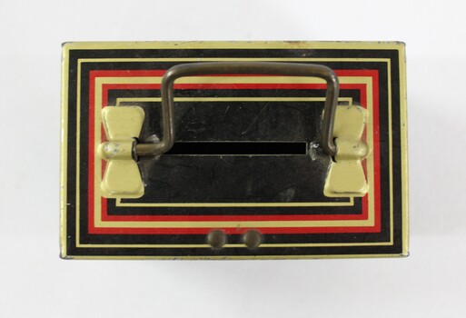 Birds eye view of Chad Valley Money Tin c. 1930s-1950s, small black tin with handle and coin slot on lid