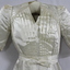A close up of the bodice of the dress
