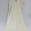 A white silk nightdress with pink embroidery around the collar and sleeves