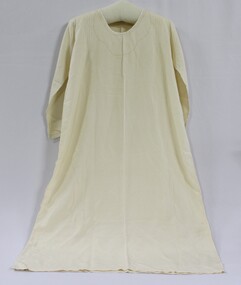 A white silk nightdress with embroidered collar and sleeves. 