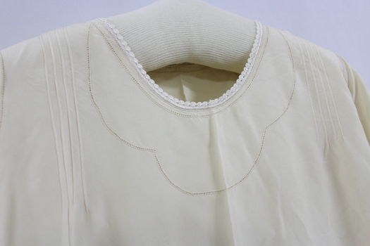 A close up of the embroidered collar of the nightdress 