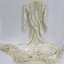 A silk wedding dress with fitted bodice and lace collar