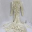 A silk wedding dress with fitted bodice and lace collar