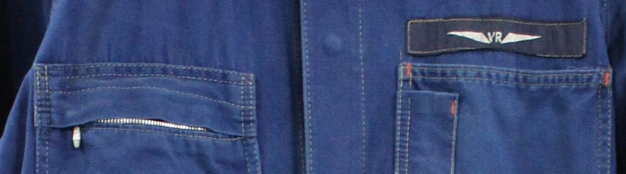 Detail of the front of the coveralls showing the Victorian Railways / VR logo.