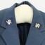 Two Victorian Railways VR logos on the lapels of a blue jacket.