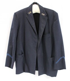Front of a blue/grey Victorian Railways jacket with "V.R." stitched to each lapel and a lighter blue trim on the lower part of each sleeve.