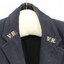 Close up of the Victorian Railways "V.R." logo stitched to each lapel.