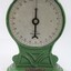 Detail of the front of the green painted cast iron scales for weighing up to 25 kg.