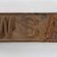 Rectangular corroded cast  iron identification tag with the letters '"WSA" on the upper surface.