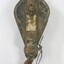 Front of an elongated ellipse-shaped metal pulley..