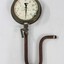 Water pump pressure gauge with a U-shaped pipe and lever.
