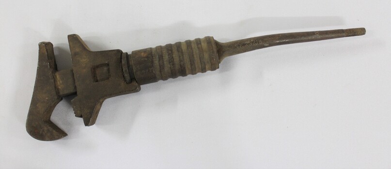 Large cast iron shifter wrench with an adjustable grip.e.