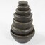 Set of seven metal weights with imperial measurements stacked from 4 oz. at the top to 7 lb. at  the bottom. 
