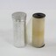 A clear film roll beside a metal film tin 