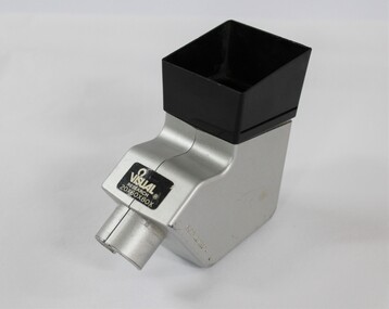 A box shaped silver and black plastic magnifier with eye piece
