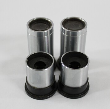Four stainless steel eyepieces with black plastic rims.