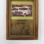 Framed ambulance plaque with 5 cm scale in the foreground.