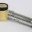 Side view of a metal and plastic flashlight magnifying glass.  