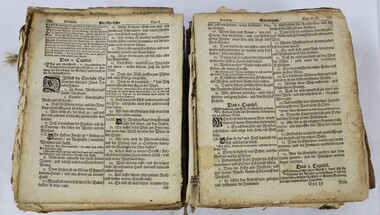 An open bible showing German text