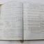 Inside of minute book showing hand written record of regular meetings. Some typed reports also included.