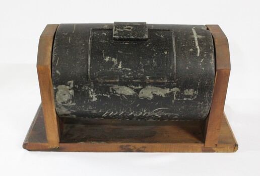 Rear view of the Jurors' Selection Barrel used in the second Wodonga Court house which was destroyed by fire. Lockable hinged door visible.