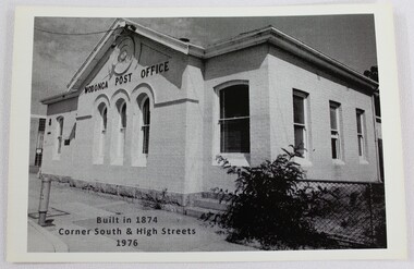 Black and white photograph of a single story white building built c.1874