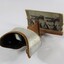 Side view of a stereoscope with cardboard 'view' of a streetscape