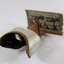 Side view of a stereoscope with cardboard 'view' of a streetscape
