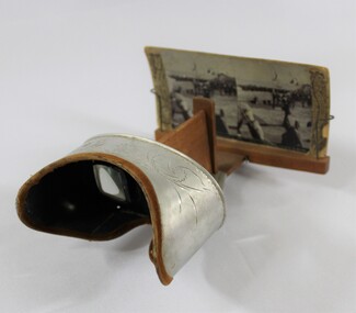 Side view of a stereoscope with cardboard 'view' of a streetscape