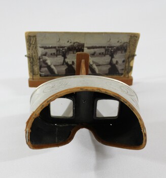 Eyepiece of a stereoscope with cardboard 'view' of a streetscape