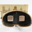 Eyepiece of a stereoscope with cardboard 'view' of a streetscape 