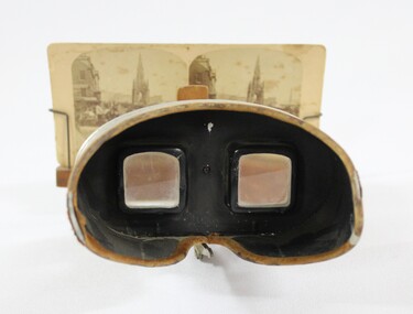 Eyepiece of a stereoscope with cardboard 'view' of a streetscape 