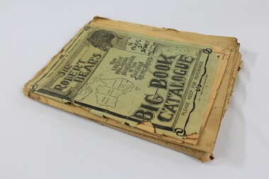 A stack of newspapers and a book catalogue 