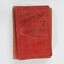 Birds eye view of red cloth bound school books `