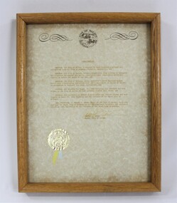 A beige certificate in a timber frame