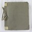 Front cover of the photograph album showing an embossed floral motif and cotton rope binding of the album spine