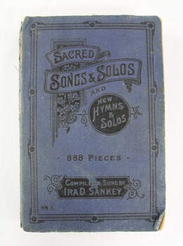 A blue hymn book with black text printed on front cover 